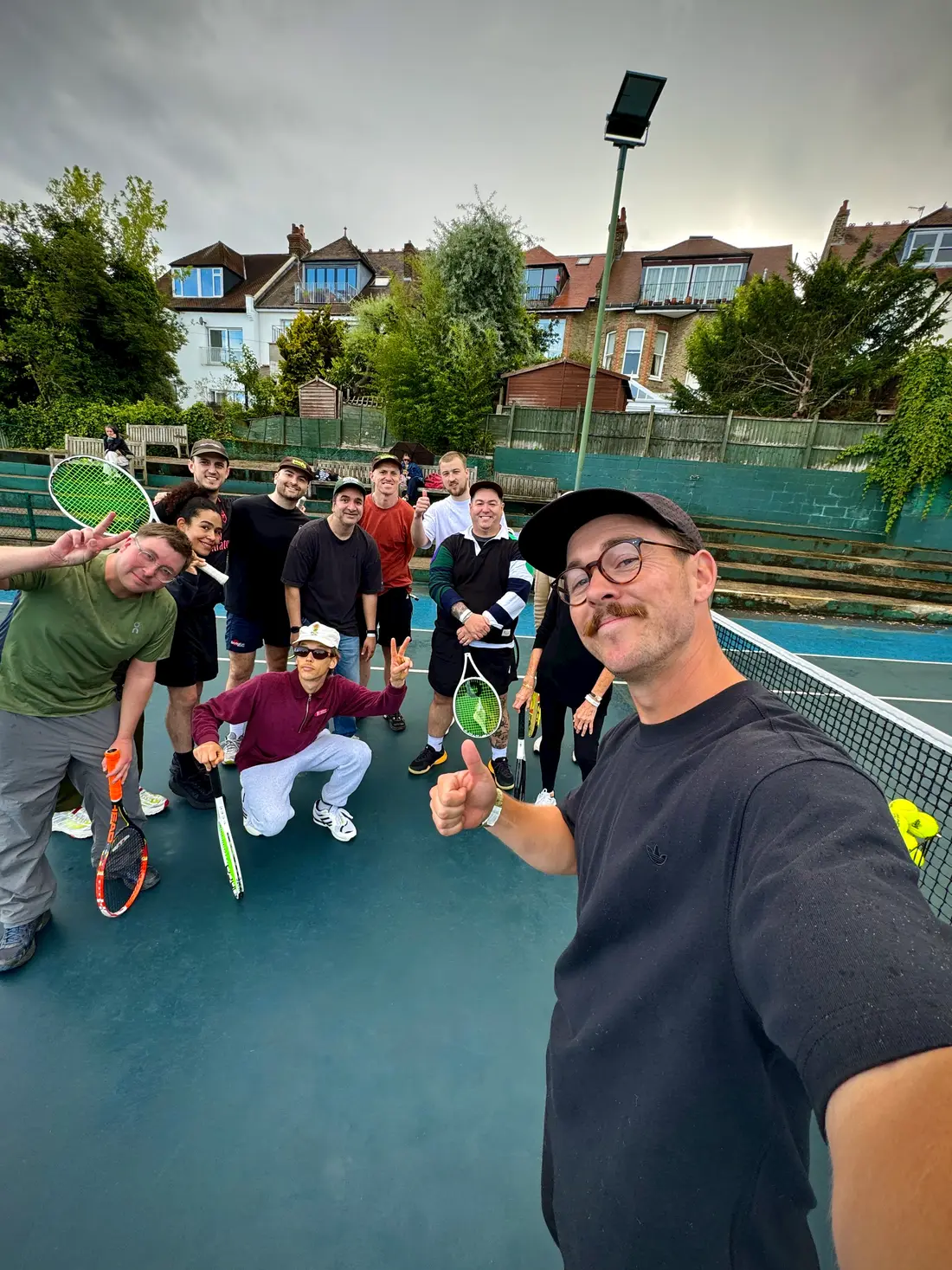 Ashley Neaves (right) with members of the Tennis Mentor community